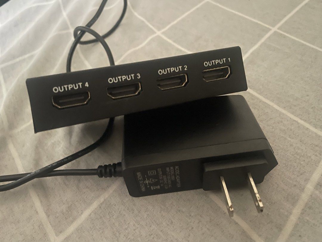 4-Port HDMI Splitter with Power Adapter (Category: Cables & Adaptors) located in Quezon City. Submitted by navielkieve (Listing ID 1462779835, Image 2). Description: - Duplicate one HDMI signal to four different displays. - Perfect for extending your display setup. - Comes with the necessary power adapter. - Tested and confirmed working..