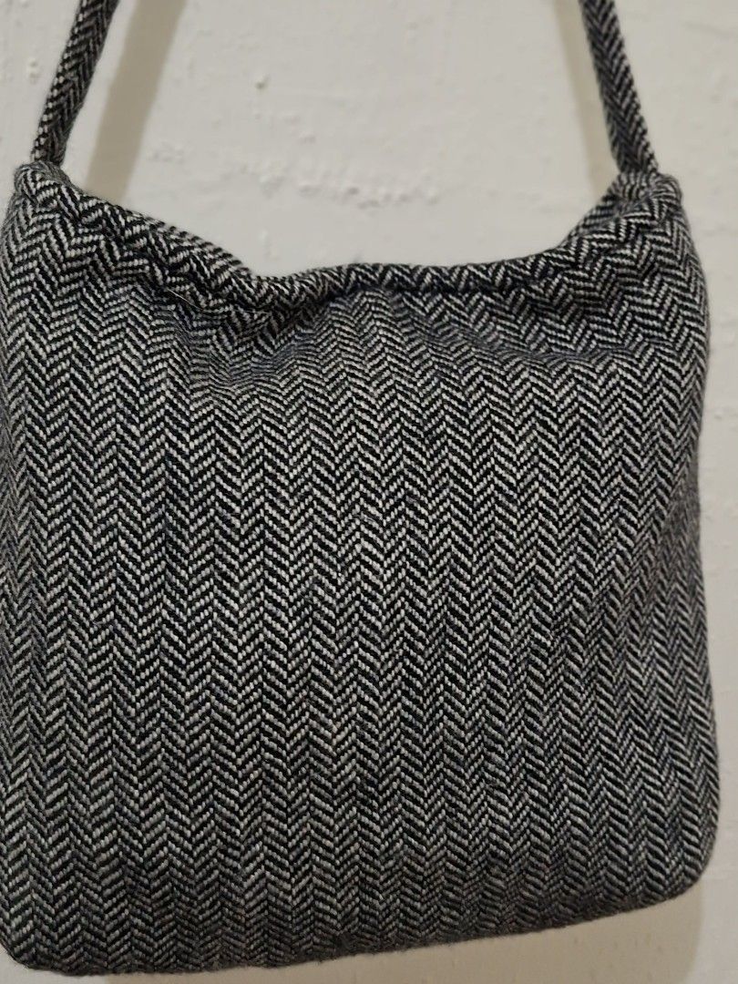 A black and gray herringbone shoulder bag (Category: Shoulder Bags) located in Caloocan City. Submitted by pvaliao (Listing ID 1462837626, Image 2). Description: A black and gray herringbone wool pattern shoulder bag with a magnetic snap fastener button. Size: 11 inches × 12 inches Pre-owned Price: 100 pesos Buy it now 😊.