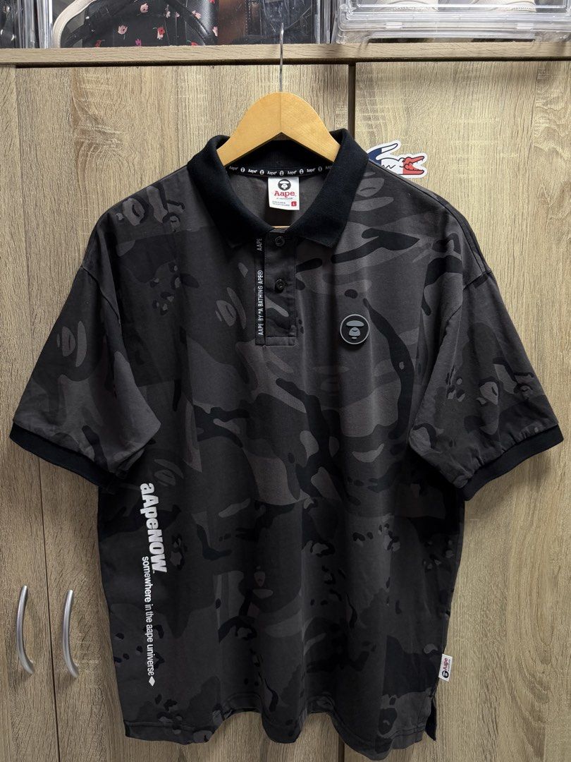 Aape Black Camo Polo Shirt (Category: Tshirts & Polo Shirts ) located in Cavite. Submitted by PRIVATE.Selection (Listing ID 1462775521, Image 1). Description: Aape Black Camo Polo Shirt Size Large W 22.5 L 28 Good as new.