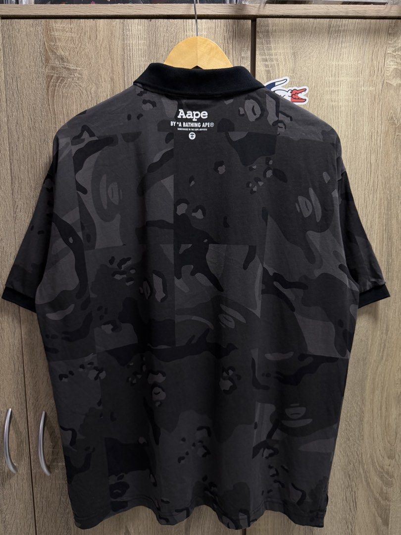 Aape Black Camo Polo Shirt (Category: Tshirts & Polo Shirts ) located in Cavite. Submitted by PRIVATE.Selection (Listing ID 1462775521, Image 3). Description: Aape Black Camo Polo Shirt Size Large W 22.5 L 28 Good as new.