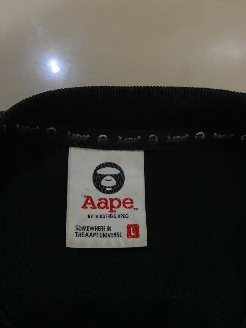 Aape T shirt (Category: Coats, Jackets and Outerwear) located in Nagcarlan. Submitted by livehorse.542a4e (Listing ID 1462735262, Image 3). Description: excellent condition cr:9.8/10 Dimes:29X23.5 issue yung sa unahan ng print tapos bukod dun wala na no basag print na.