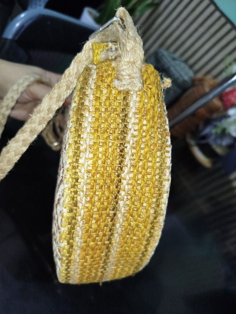 Abaca Sling Bag with Adjustable Strap (Category: Cross-body Bags) located in Cabuyao City. Submitted by elaine.toqz (Listing ID 1462727275, Image 3). Description: - Cute round woven bag - Natural straw material - Diamond pattern on one side - Yellow and white woven texture on sides - Zipper closure - Adjustable braided strap - Ideal for casual outings.