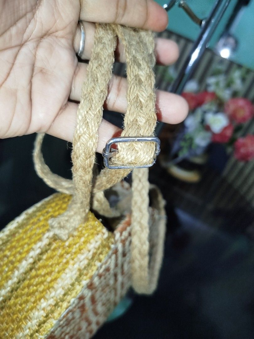 Abaca Sling Bag with Adjustable Strap (Category: Cross-body Bags) located in Cabuyao City. Submitted by elaine.toqz (Listing ID 1462727275, Image 2). Description: - Cute round woven bag - Natural straw material - Diamond pattern on one side - Yellow and white woven texture on sides - Zipper closure - Adjustable braided strap - Ideal for casual outings.