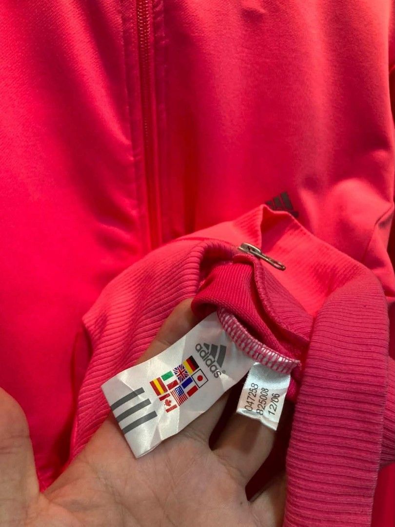Adidas Clima365 Pink Track Jacket (Category: Coats, Jackets and Outerwear) located in Trece Martires City. Submitted by djaothriftshop (Listing ID 1462852191, Image 3). Description: - Vibrant bright pink Adidas track jacket - Clima365 technology for optimal performance - Stylish embossed Adidas logo on the back - Convenient full zip front with pockets - Comfortable ribbed cuffs and hem - Ideal for both workouts and everyday casual wear.
