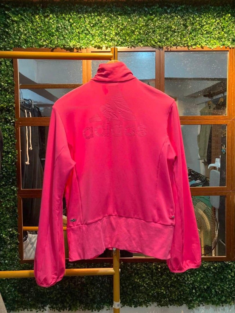 Adidas Clima365 Pink Track Jacket (Category: Coats, Jackets and Outerwear) located in Trece Martires City. Submitted by djaothriftshop (Listing ID 1462852191, Image 2). Description: - Vibrant bright pink Adidas track jacket - Clima365 technology for optimal performance - Stylish embossed Adidas logo on the back - Convenient full zip front with pockets - Comfortable ribbed cuffs and hem - Ideal for both workouts and everyday casual wear.