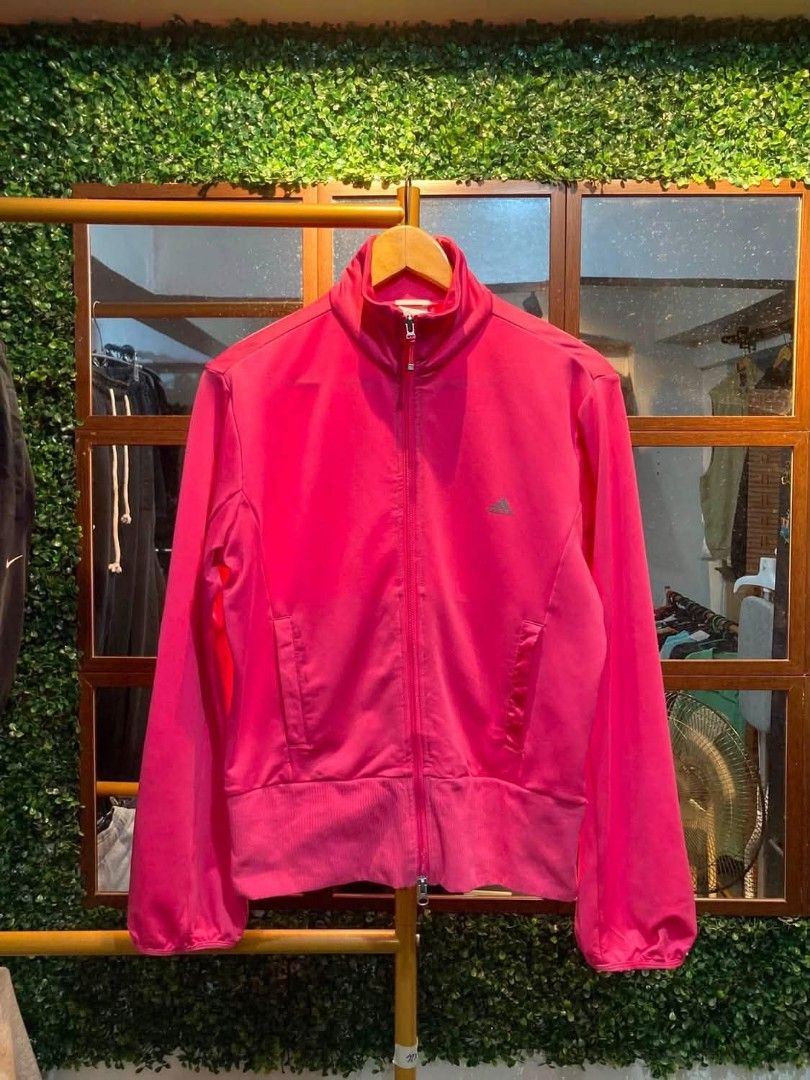 Adidas Clima365 Pink Track Jacket (Category: Coats, Jackets and Outerwear) located in Trece Martires City. Submitted by djaothriftshop (Listing ID 1462852191, Image 1). Description: - Vibrant bright pink Adidas track jacket - Clima365 technology for optimal performance - Stylish embossed Adidas logo on the back - Convenient full zip front with pockets - Comfortable ribbed cuffs and hem - Ideal for both workouts and everyday casual wear.