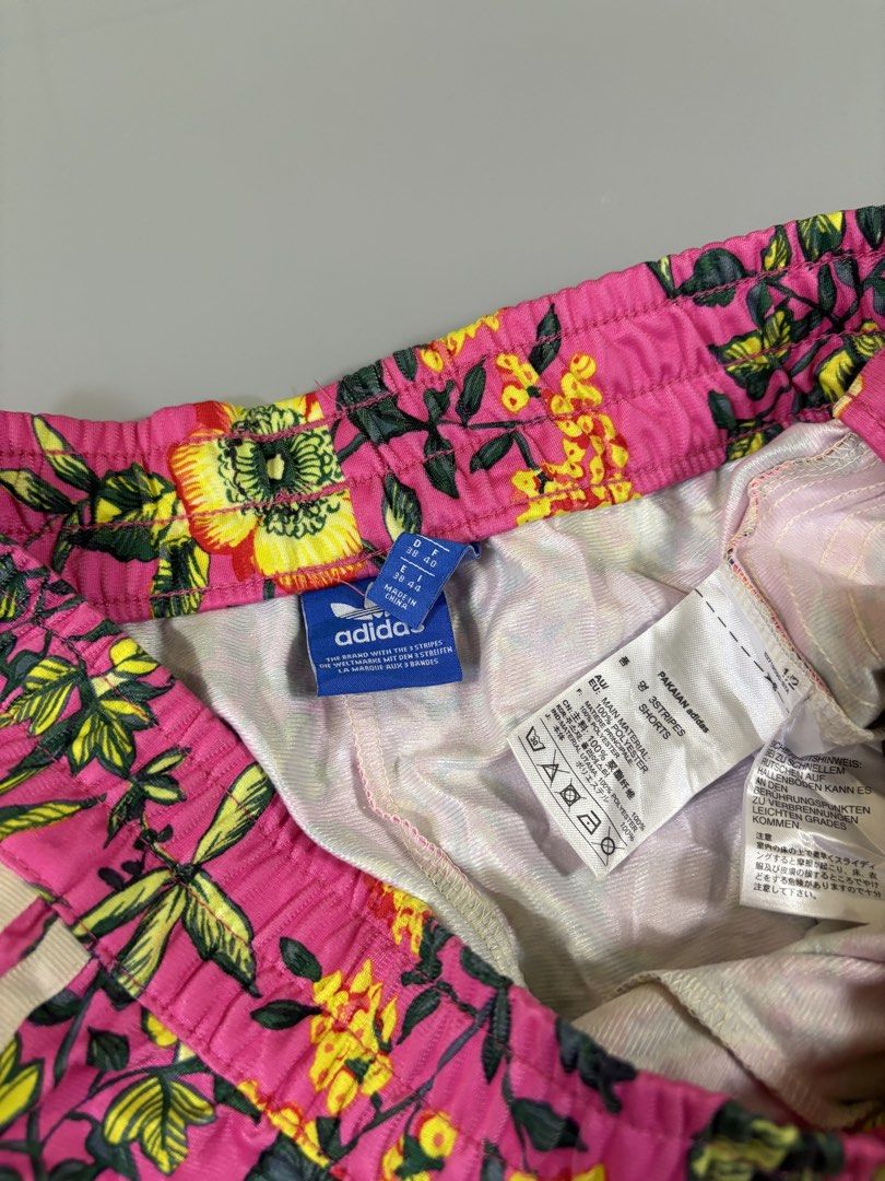 Adidas Floral Print Shorts (Category: Shorts) located in Davao. Submitted by brandedthrift.134 (Listing ID 1462818589, Image 3). Description: - Super cute Adidas shorts with vibrant floral print -Waistline:28”-29” - Features classic three stripes on the sides - Elastic waistband for a comfortable fit - Versatile: great for workouts or casual wear - Material: 100% polyester.