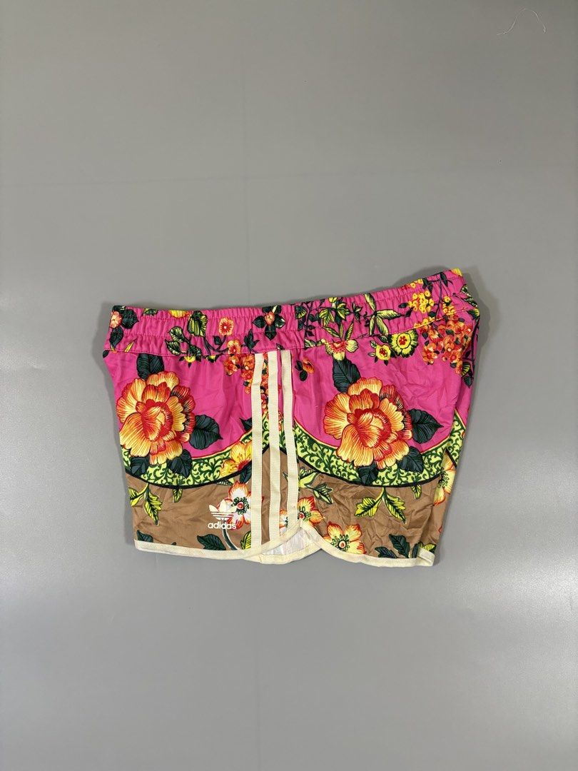 Adidas Floral Print Shorts (Category: Shorts) located in Davao. Submitted by brandedthrift.134 (Listing ID 1462818589, Image 1). Description: - Super cute Adidas shorts with vibrant floral print -Waistline:28”-29” - Features classic three stripes on the sides - Elastic waistband for a comfortable fit - Versatile: great for workouts or casual wear - Material: 100% polyester.