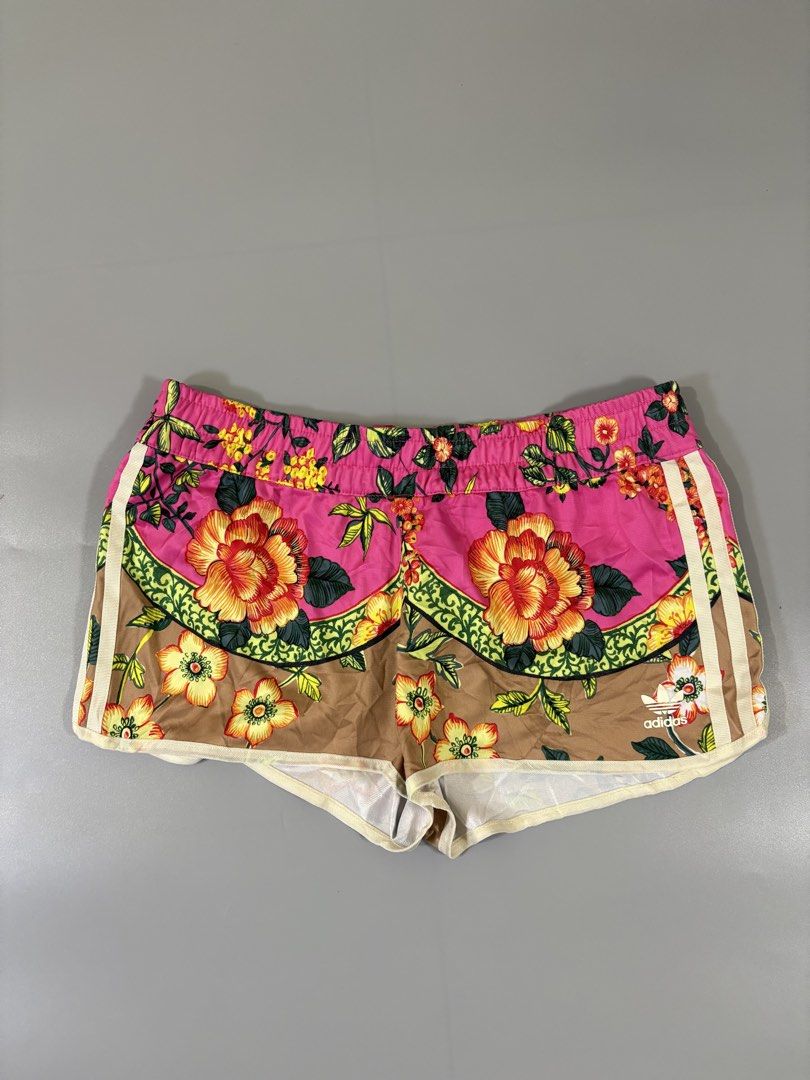 Adidas Floral Print Shorts (Category: Shorts) located in Davao. Submitted by brandedthrift.134 (Listing ID 1462818589, Image 2). Description: - Super cute Adidas shorts with vibrant floral print -Waistline:28”-29” - Features classic three stripes on the sides - Elastic waistband for a comfortable fit - Versatile: great for workouts or casual wear - Material: 100% polyester.