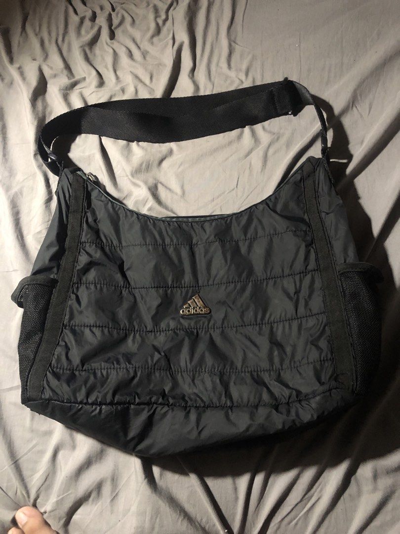 Adidas Quilted Shoulder Bag (Category: Shoulder Bags) located in Manila. Submitted by bakithrift213 (Listing ID 1462810833, Image 1). Description: - Black Adidas shoulder bag - Padded material with quilted stitching - Features mesh pockets on the sides - Adjustable strap for comfort - Ideal for everyday use or gym sessions.