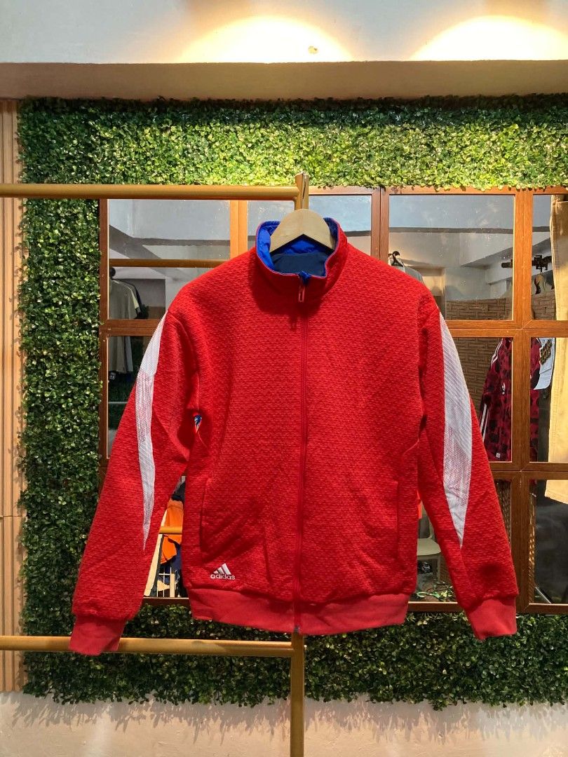Adidas Reversible Track Jacket Blue Red (Category: Coats, Jackets and Outerwear) located in Trece Martires City. Submitted by djaothriftshop (Listing ID 1462783733, Image 2). Description: - Reversible Adidas jacket: two looks in one! - Side 1: Blue with a large red Adidas logo. - Side 2: Red with white stripes on the sleeves. - Ideal for casual wear or sports activities..