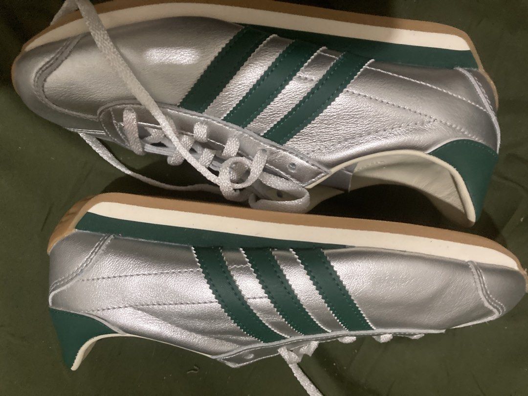 Adidas Silver Green Stripes Sneakers (Category: Sneakers) located in Tacloban City. Submitted by sid1999 (Listing ID 1462699801, Image 3). Description: - Silver Adidas sneakers - Features iconic green stripes - Classic lace-up closure - Made in Indonesia - Size: US 6 / UK 4.5 / FR 37.5 / JP 230 / CHN 230 (refer to label for full details) - Ideal for everyday casual wear.