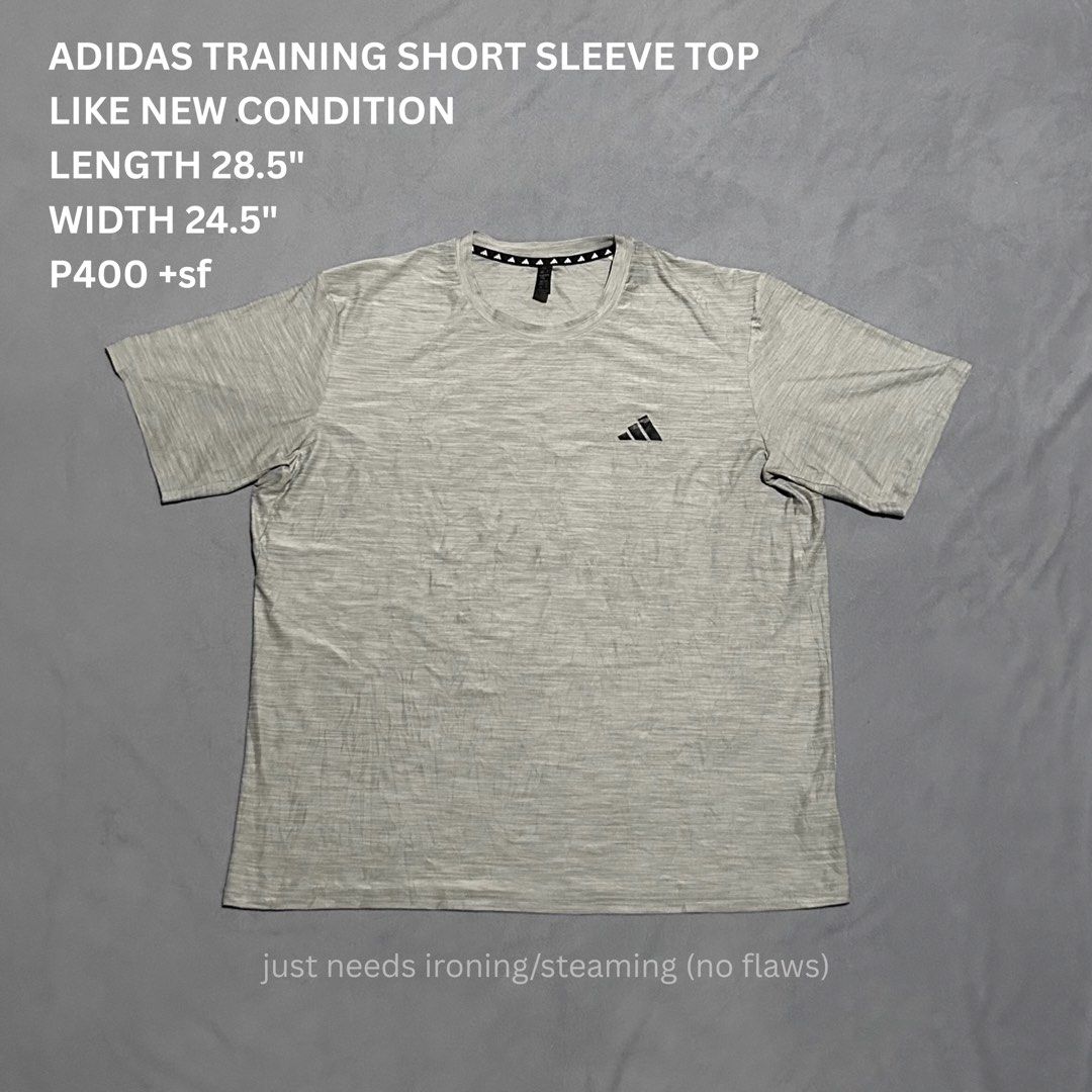 Adidas T-shirt XXL (Category: Activewear) located in Miagao. Submitted by juliusokra (Listing ID 1462850561, Image 1). Description: - Grey Adidas training top - Size XXL - Short sleeves, crew neck - Features Adidas logo on chest and sleeve - Made with Aeroready material for moisture-wicking.