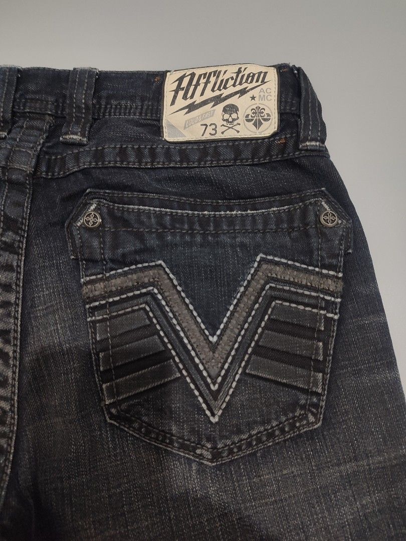 Affliction Jeans (Category: Jeans) located in Lipa City. Submitted by gudoys_outdoor16 (Listing ID 1462843509, Image 3). Description: - Brand: Affliction - Type: Dark Wash Denim Jeans - Size: 30 Waist - Length 41.5 - Features: Signature V-stitch detail on back pockets - Material: 100% Cotton - Style: Great for casual wear - Condition: Please check photos for exact look 2500 Only Free Shipping.