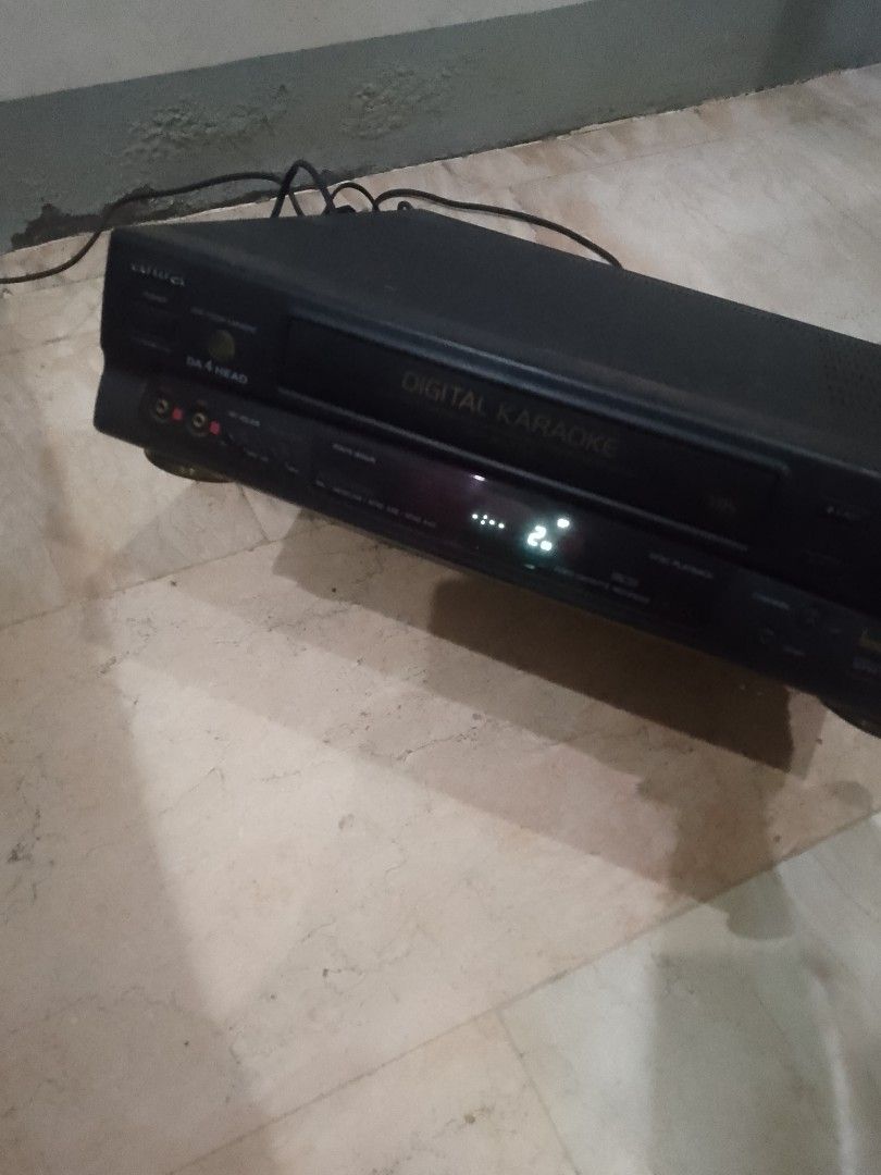 Aiwa Digital Karaoke Player VCR Combo (Category: Portable Music Players) located in Manila. Submitted by alterwind (Listing ID 1462717348, Image 1). Description: - Aiwa VCR Karaoke Combo Unit - Features 'Digital Karaoke' branding - Multiple inputs and outputs on the back - Tested and confirmed working - Power cord included.