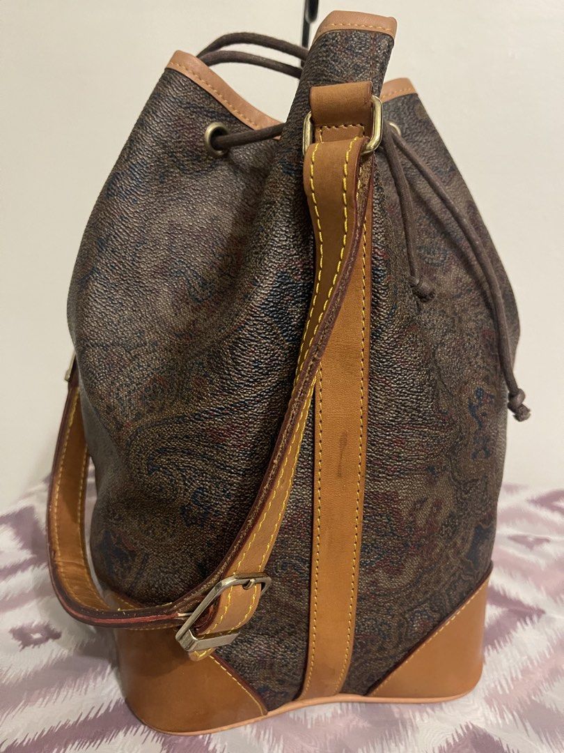 Alain Gilardi Paris Monogram Bucket Bag (Category: Luxury Bags & Wallets) located in General Trias. Submitted by laconchita_tesoros (Listing ID 1462728414, Image 3). Description: - Vintage Alain Gilardi Paris bucket bag - Classic monogram print - Tan leather trim and strap - Secure drawstring closure - Perfect size for everyday essentials - Stylish Parisian accessory.
