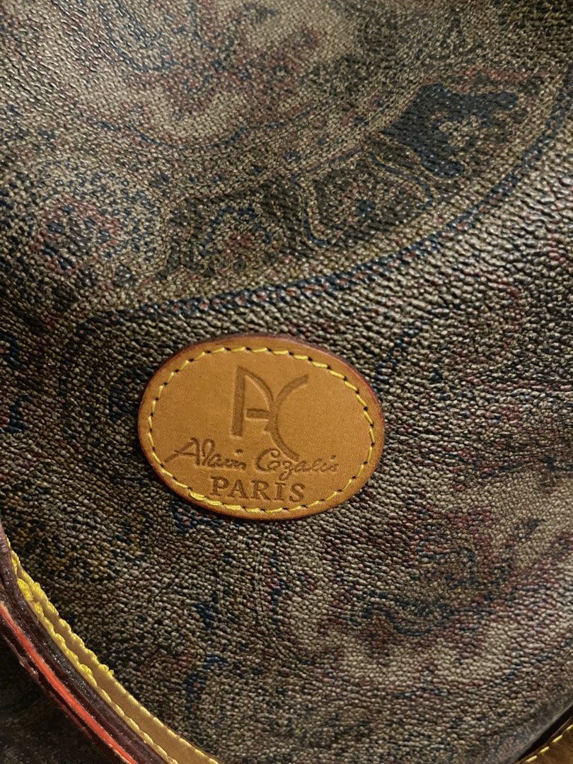 Alain Gilardi Paris Monogram Bucket Bag (Category: Luxury Bags & Wallets) located in General Trias. Submitted by laconchita_tesoros (Listing ID 1462728414, Image 2). Description: - Vintage Alain Gilardi Paris bucket bag - Classic monogram print - Tan leather trim and strap - Secure drawstring closure - Perfect size for everyday essentials - Stylish Parisian accessory.