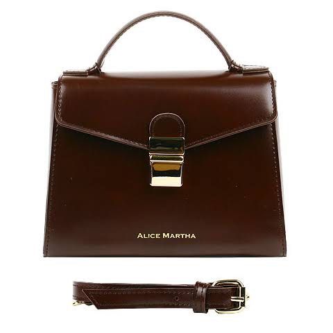 Alice Martha Brown Leather Top Handle Bag with Strap (Category: Cross-body Bags) located in Taguig. Submitted by swiftearth_250c75 (Listing ID 1462757612, Image 1). Description: - Brand: Alice Martha - Material: Genuine Leather - Color: Brown - Handle: Top handle - Strap: Detachable shoulder strap - Closure: Gold-tone clasp - Interior: Zippered pocket, small leather tag - Versatile: Ideal for daily use or special occasions.