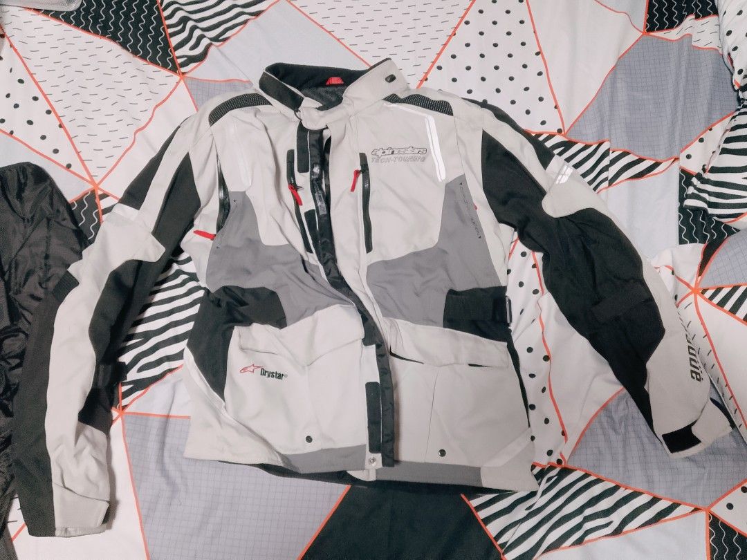 Alpinestars Tech-Touring Drystar Motorcycle Jacket (Category: Coats, Jackets and Outerwear) located in San Fernando. Submitted by tkdchester.1 (Listing ID 1462702053, Image 3). Description: - Alpinestars Tech-Touring Drystar motorcycle jacket - Color: Grey, black, and white - Features a ventilation system on the back - Multiple pockets on the front - Reflective detailing for enhanced visibility - Ideal for touring rides.