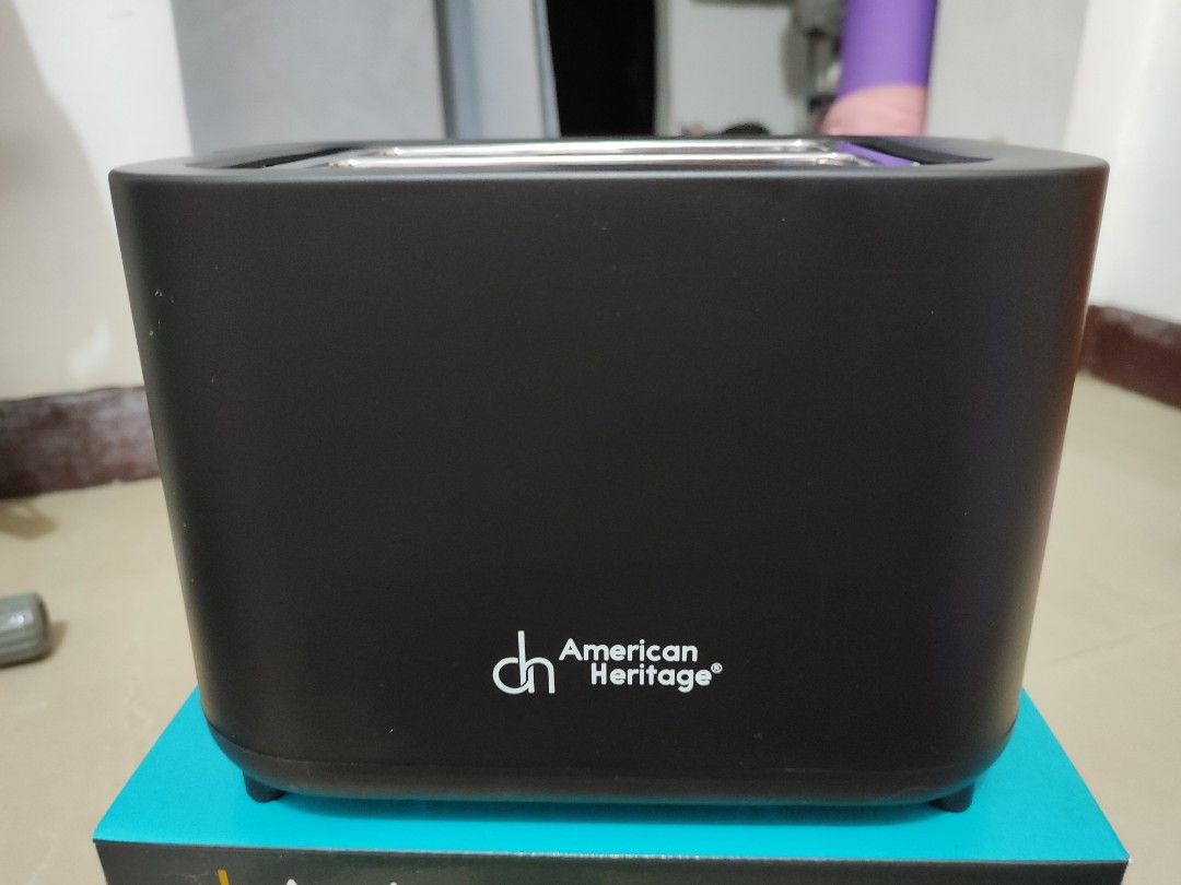 American Heritage 2-Slice Bread Toaster (Category: Ovens & Toasters) located in Pasay City. Submitted by chachi.romualdo (Listing ID 1462701093, Image 2). Description: - American Heritage 2-slice bread toaster - Auto-centering bread holder for even toasting - Sleek black exterior - Interior looks clean - Includes original box - Never been used, just opened for testing purposes .