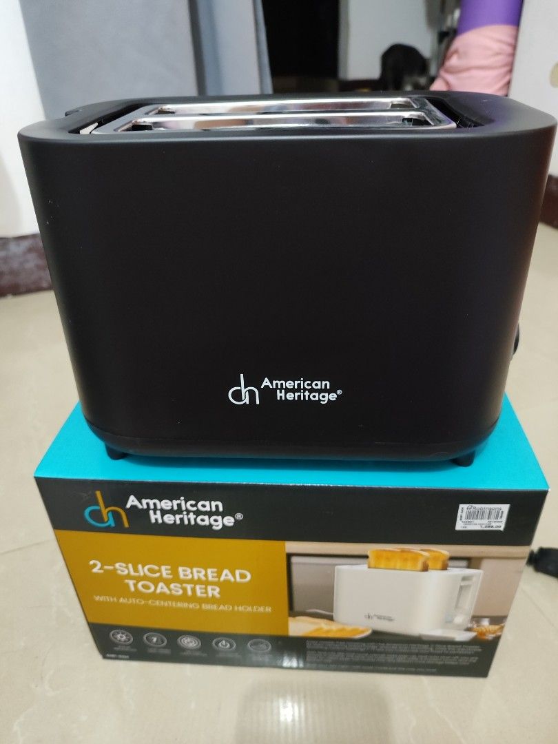 American Heritage 2-Slice Bread Toaster (Category: Ovens & Toasters) located in Pasay City. Submitted by chachi.romualdo (Listing ID 1462701093, Image 1). Description: - American Heritage 2-slice bread toaster - Auto-centering bread holder for even toasting - Sleek black exterior - Interior looks clean - Includes original box - Never been used, just opened for testing purposes .