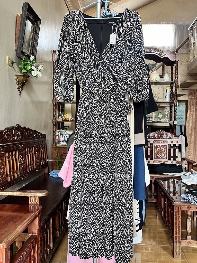 Andrew Marc Zebra Print Wrap Dress (Category: Dresses) located in Dinalupihan. Submitted by penaflorcj (Listing ID 1462705744, Image 2). Description: - Andrew Marc zebra print wrap dress - Midi length - Tie waist - 3/4 sleeves - Versatile for dressing up or down rfs: decluttering *sale price + discount when you buy more than 2 items.