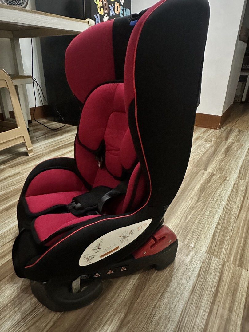 Apruva Car Seat Red and Black (Category: Car Seats) located in Manila. Submitted by jls.01 (Listing ID 1462820353, Image 2). Description: - Apruva Car Seat (Red & Black) - Features a secure 5-point harness - Padded for maximum comfort - Ideal for toddlers - Simple and easy installation - Cleaned and ready for its next journey - Ensures your child's safety on the road - Minimal Color Fadings on upper, 3x lang nagamit ni Baby, nagfade kasi na-stock