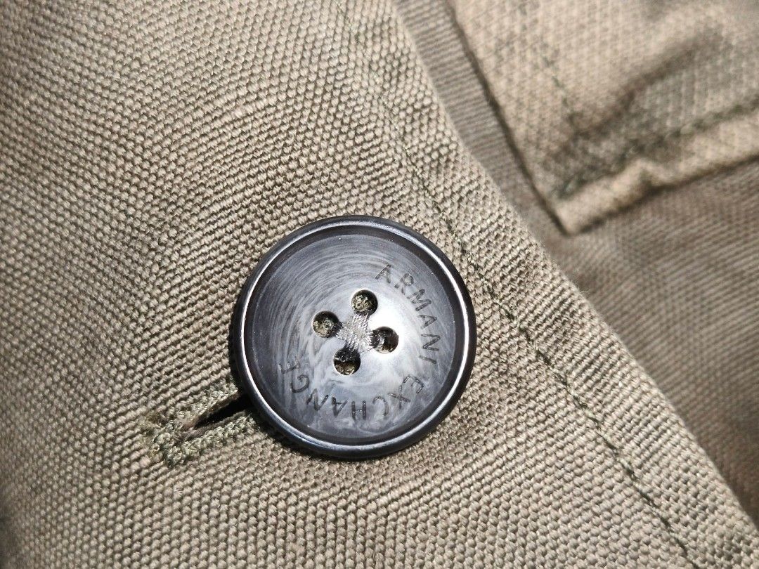 Armani Exchange Olive Utility Blazer (Category: Coats, Jackets and Outerwear) located in Baguio. Submitted by luxeloomarchive (Listing ID 1462853034, Image 3). Description: Armani Exchange Olive Utility Blazer ​Elevate your casual tailoring with this authentic Armani Exchange utility-style blazer. Crafted from a breathable 60% cotton / 40% linen blend in a versatile olive green, it features a 2-button front, front patch pockets, and signature eng
