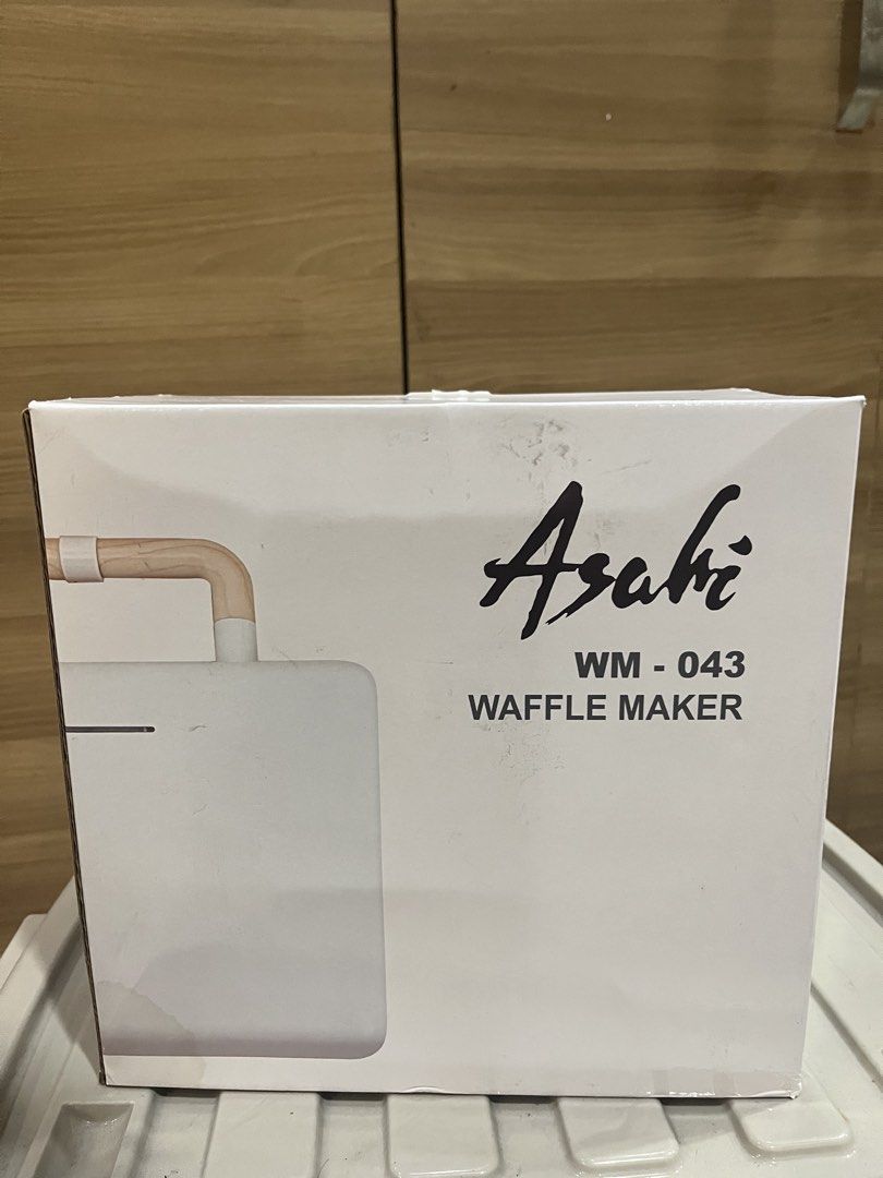 Asahi WM-043 Waffle Maker (Category: Other Kitchen Appliances) located in Manila. Submitted by jericho_chan (Listing ID 1462725323, Image 1). Description: - Asahi WM-043 Waffle Maker - Interchangeable waffle and panini press plates - Stylish white and wood accent design - Ideal for delicious breakfasts and quick snacks - Compact and easy to store.