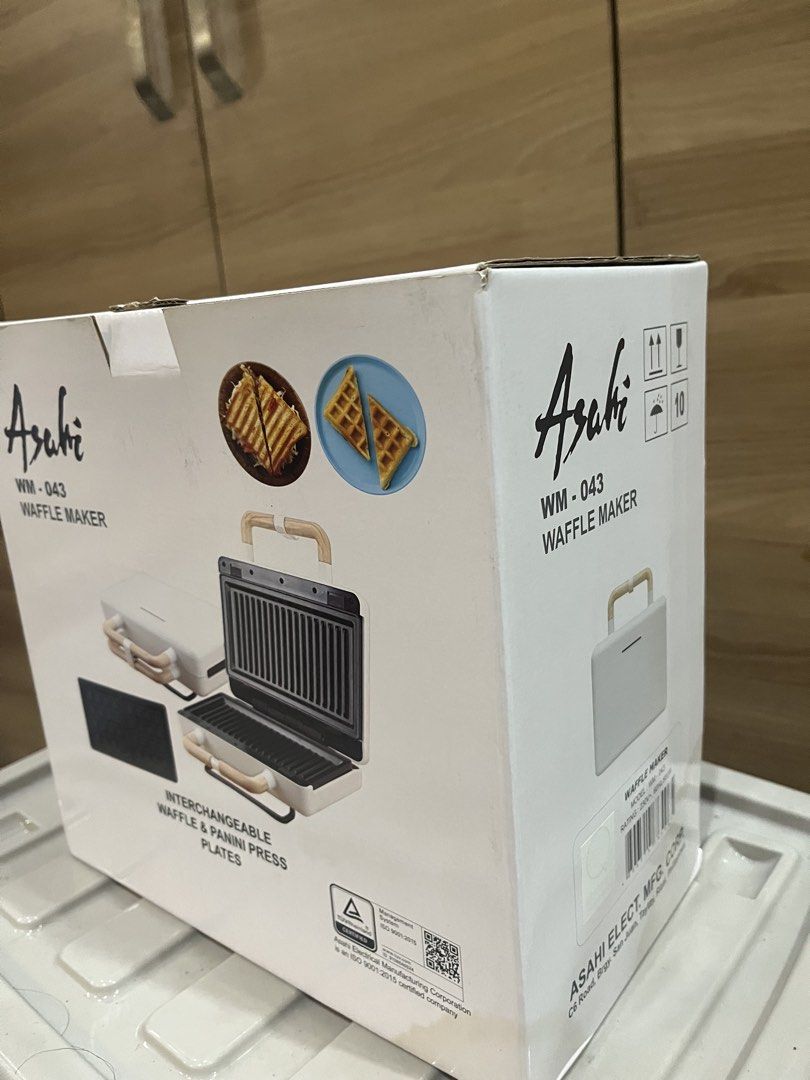 Asahi WM-043 Waffle Maker (Category: Other Kitchen Appliances) located in Manila. Submitted by jericho_chan (Listing ID 1462725323, Image 3). Description: - Asahi WM-043 Waffle Maker - Interchangeable waffle and panini press plates - Stylish white and wood accent design - Ideal for delicious breakfasts and quick snacks - Compact and easy to store.