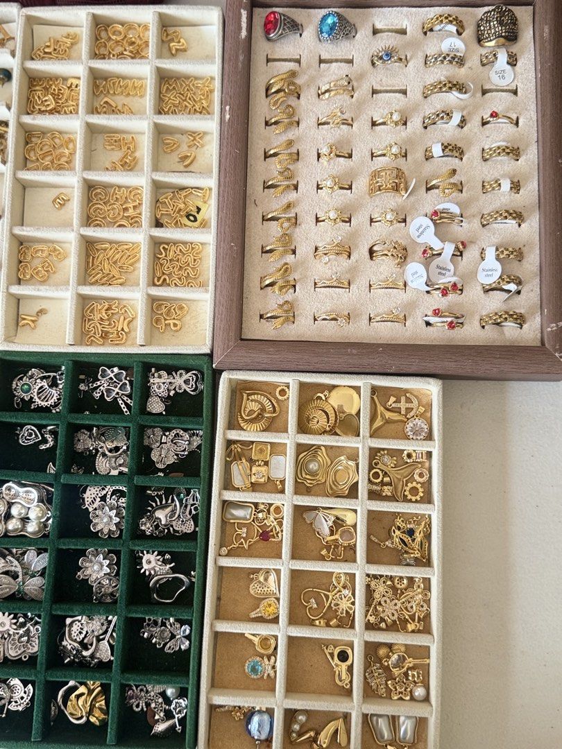 Assorted Gold and Silver Charms, Letters, and Rings (Category: Charms) located in Quezon City. Submitted by charmenella (Listing ID 1462689661, Image 3). Description: - Assorted jewelry making supplies - Includes gold alphabet letters - Various gold and silver charms - Assorted rings - All items neatly organized in trays - Sold as a bundle - Ideal for crafting or customizing jewelry More freebies as well slightly negotiable ALL BRAND NEW good for