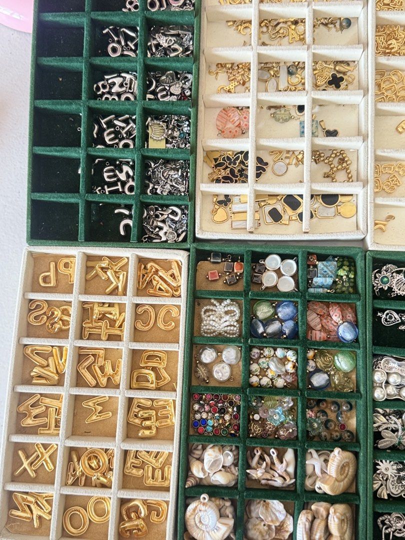 Assorted Gold and Silver Charms, Letters, and Rings (Category: Charms) located in Quezon City. Submitted by charmenella (Listing ID 1462689661, Image 1). Description: - Assorted jewelry making supplies - Includes gold alphabet letters - Various gold and silver charms - Assorted rings - All items neatly organized in trays - Sold as a bundle - Ideal for crafting or customizing jewelry More freebies as well slightly negotiable ALL BRAND NEW good for