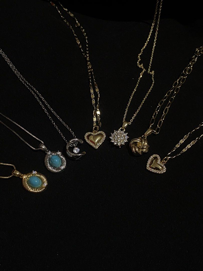 Assorted Necklaces - Gold and Silver Tones (Category: Necklaces) located in Davao. Submitted by alessuh (Listing ID 1462697261, Image 1). Description: - Bundle of delicate and stylish necklaces. - Mix of gold and silver tones. - Features heart, moon, gemstone, and intricate pendant designs. - Ideal for layering or wearing individually. - Adds a touch of sparkle to any outfit..