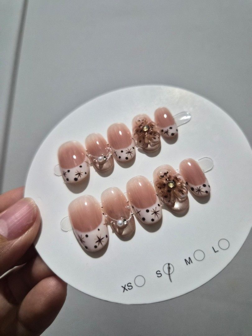 Assorted Press-On Nails - Various Designs (Category: Hands & Nails) located in Quezon City. Submitted by nataliacristina71726 (Listing ID 1462762528, Image 2). Description: - Assorted set of press-on nails - Includes multiple designs and sizes - Features glitter, floral accents, and French tips - Ideal for quick manicures or special occasions - Easy to apply at home - Please check photos for all included designs.