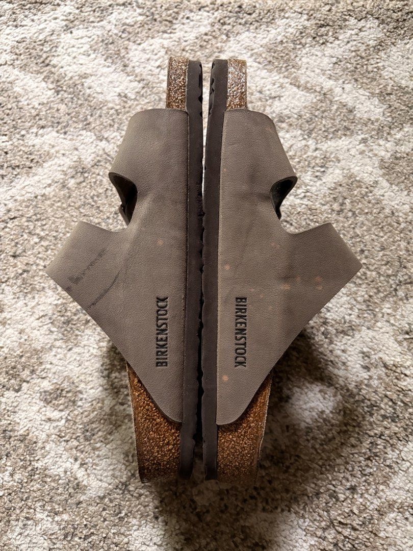 Auth Preloved Arizona Birkenstock (Category: Slippers & Slides) located in Paranaque City. Submitted by silentstone.dolphin (Listing ID 1462779941, Image 3). Description: With mnimal sign of used.. Stone Color Strap.. Brass Buckle.. Visible Print.. Size 40N.. Clean&Ready to Wear👌 Best Seller Colorway!💰 Super Nice in Actual😍.