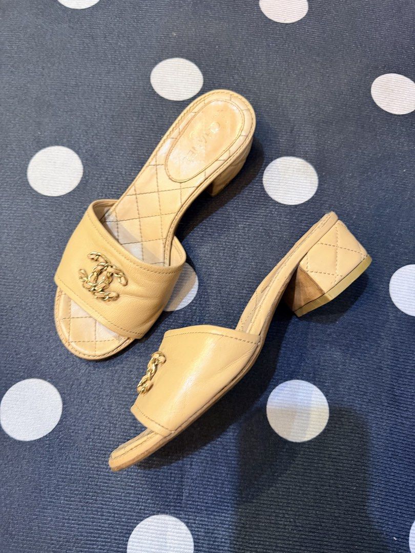 Authentic Chanel Beige Quilted CC Logo 35 Mules Sandals Size 36 (Category: Flats & Sandals) located in Dumaguete. Submitted by lovebags.ph (Listing ID 1462829393, Image 1). Description: - Authentic Chanel mules in elegant beige. - Features the signature CC logo on the strap. - Luxurious quilted detailing on the footbed and heel. - Convenient slip-on style for easy wear. - Moderate heel height for comfort and style. - Expertly crafted in Italy..