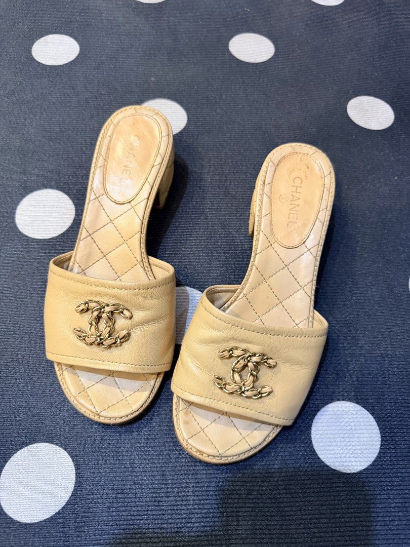 Authentic Chanel Beige Quilted CC Logo 35 Mules Sandals Size 36 (Category: Flats & Sandals) located in Dumaguete. Submitted by lovebags.ph (Listing ID 1462829393, Image 2). Description: - Authentic Chanel mules in elegant beige. - Features the signature CC logo on the strap. - Luxurious quilted detailing on the footbed and heel. - Convenient slip-on style for easy wear. - Moderate heel height for comfort and style. - Expertly crafted in Italy..