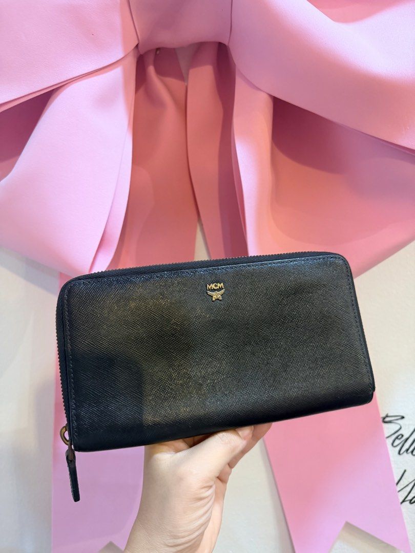 Authentic MCM Black Zip Around Wallet (Category: Luxury Bags & Wallets) located in Dumaguete. Submitted by lovebags.ph (Listing ID 1462825649, Image 1). Description: - Authentic MCM wallet - Color: Black leather - Features iconic gold MCM logo - Secure zip-around closure - Ample interior space for cards and cash - Ideal for everyday use - Feel free to ask any questions!.