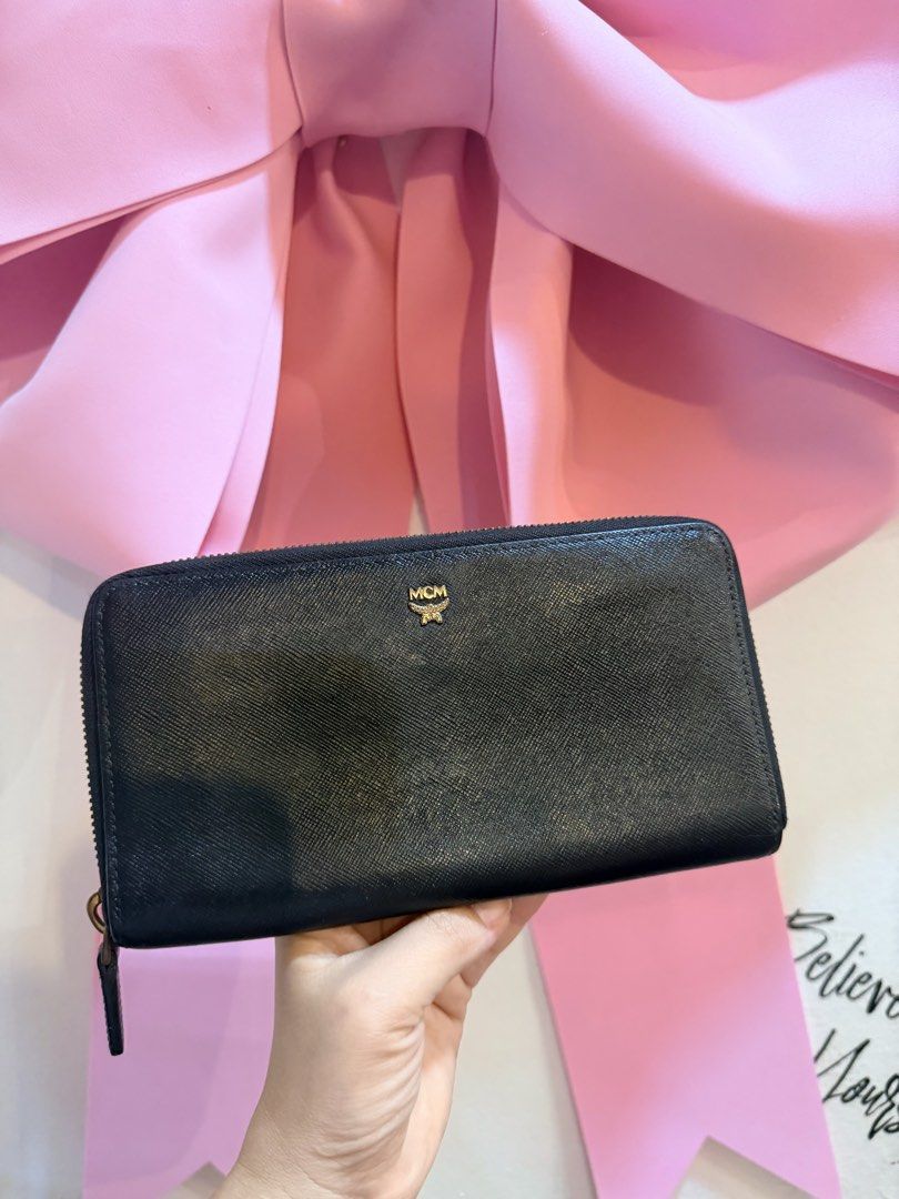 Authentic MCM Black Zip Around Wallet (Category: Luxury Bags & Wallets) located in Dumaguete. Submitted by lovebags.ph (Listing ID 1462825649, Image 3). Description: - Authentic MCM wallet - Color: Black leather - Features iconic gold MCM logo - Secure zip-around closure - Ample interior space for cards and cash - Ideal for everyday use - Feel free to ask any questions!.