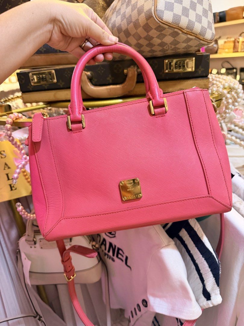 Authentic MCM Saffiano Pink Leather Top Handle Bag (Category: Luxury Bags & Wallets) located in Dumaguete. Submitted by lovebags.ph (Listing ID 1462827509, Image 2). Description: - Cute pink MCM bag - Saffiano leather - Gold hardware details - Detachable shoulder strap - Top zip closure - Spacious interior for essentials - Versatile for daily use or nights out.