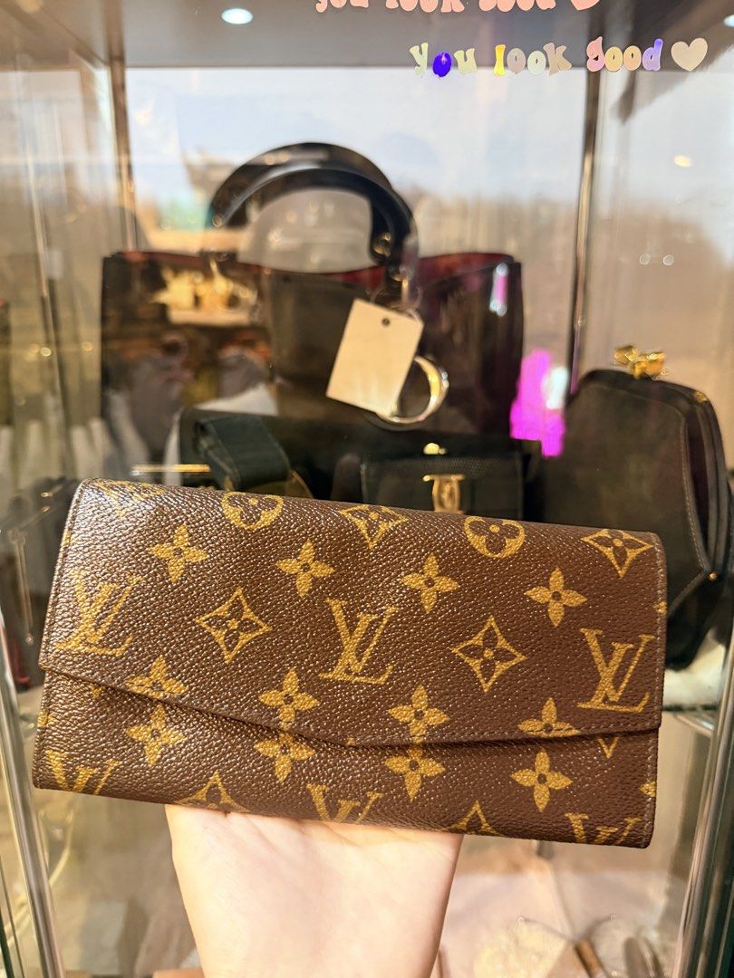 Authentic Vintage Louis Vuitton Monogram Canvas Trifold Wallet (Category: Luxury Bags & Wallets) located in Dumaguete. Submitted by lovebags.ph (Listing ID 1462825221, Image 3). Description: - Authentic Louis Vuitton monogram wallet - Classic trifold design - Ample space for cards and cash - Shows some signs of wear on edges and corners - Still a great piece for everyday use Flawless.