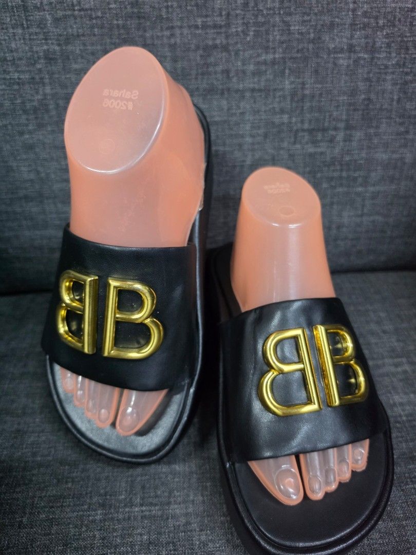 Balenciaga BB Platform Slides Black (Category: Slippers and slides) located in General Trias. Submitted by roselle2230 (Listing ID 1462833219, Image 2). Description: - Authentic Black Balenciaga Slides - Features iconic Gold BB Logo - Comfortable Platform Sole - Durable Rubber Sole with Balenciaga Branding - Ideal for stylish casual wear.