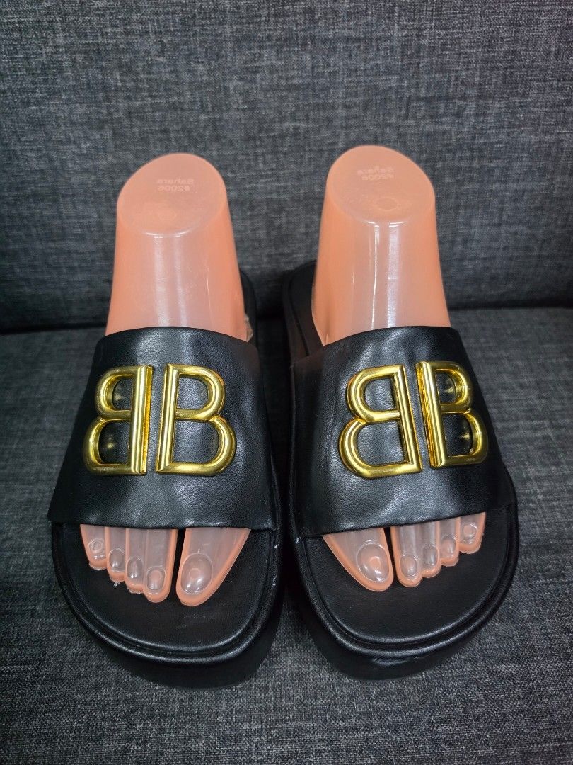 Balenciaga BB Platform Slides Black (Category: Slippers and slides) located in General Trias. Submitted by roselle2230 (Listing ID 1462833219, Image 1). Description: - Authentic Black Balenciaga Slides - Features iconic Gold BB Logo - Comfortable Platform Sole - Durable Rubber Sole with Balenciaga Branding - Ideal for stylish casual wear.