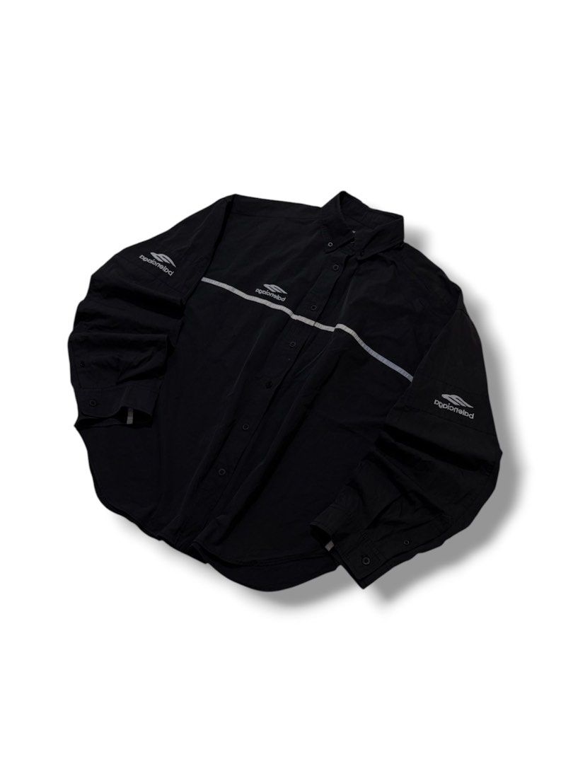 Balenciaga Black multi Logo Button-Up (Category: Tshirts & Polo Shirts ) located in Cabuyao City. Submitted by 0ld_souls (Listing ID 1462866001, Image 1). Description: - Authentic Balenciaga black button-up shirt - Size: Tag shows 2 - Features iconic Balenciaga logo on chest and sleeves - Stylish reflective stripe detail across front and back - Classic button closure - A great addition to any wardrobe.