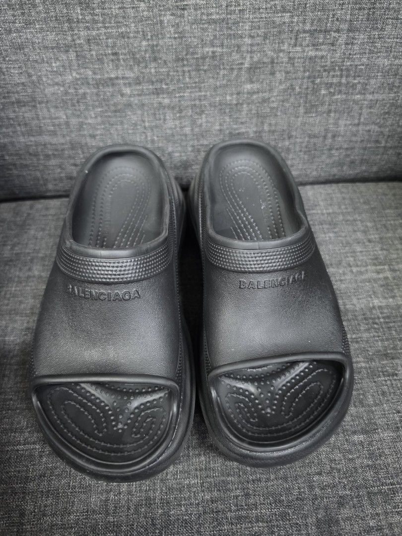 Balenciaga Black Slides (Category: Wedges) located in General Trias. Submitted by roselle2230 (Listing ID 1462832558, Image 1). Description: - Classic black Balenciaga slides - Features prominent Balenciaga logo on the strap - Comfortable and easy slip-on design - Textured grip sole for stability - Ideal for casual outings or post-workout wear - Genuine "Made in Italy" craftsmanship.