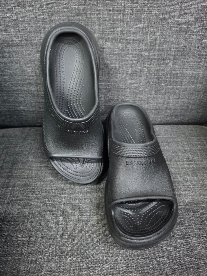 Balenciaga Black Slides (Category: Wedges) located in General Trias. Submitted by roselle2230 (Listing ID 1462832558, Image 2). Description: - Classic black Balenciaga slides - Features prominent Balenciaga logo on the strap - Comfortable and easy slip-on design - Textured grip sole for stability - Ideal for casual outings or post-workout wear - Genuine "Made in Italy" craftsmanship.