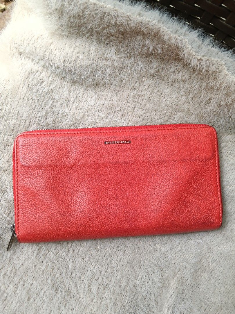Balenciaga Red Leather Zip Around Wallet (Category: Luxury Bags & Wallets) located in Antipolo. Submitted by vastgem_4c8da8 (Listing ID 1462720576, Image 1). Description: - Balenciaga zip-around wallet - Vibrant red textured leather - Sleek silver hardware - Ample card slots and compartments - Perfect for organizing your essentials - A classic Balenciaga design.