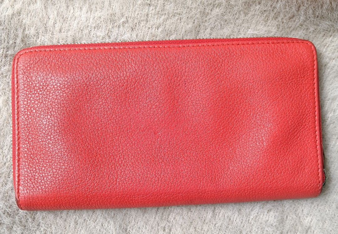 Balenciaga Red Leather Zip Around Wallet (Category: Luxury Bags & Wallets) located in Antipolo. Submitted by vastgem_4c8da8 (Listing ID 1462720576, Image 3). Description: - Balenciaga zip-around wallet - Vibrant red textured leather - Sleek silver hardware - Ample card slots and compartments - Perfect for organizing your essentials - A classic Balenciaga design.