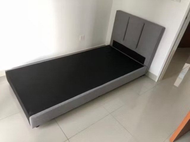 Bed frame (Category: Bed Frames & Mattresses) located in Ayer Baloi. Submitted by chuaxiaowe15144 (Listing ID 1462811882, Image 1). Description: Made a small accidental cut on the back black fabric while unboxing. Completely hidden once against the wall and doesn‘t affect use/structure..