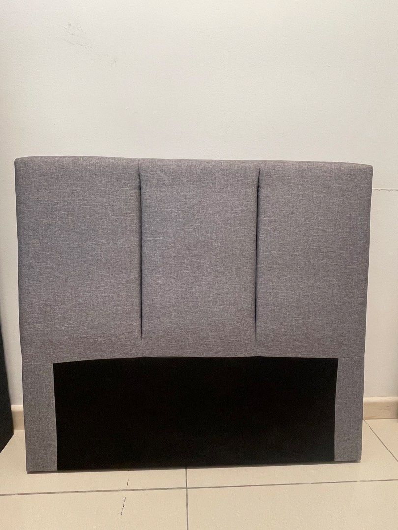 Bed frame (Category: Bed Frames & Mattresses) located in Ayer Baloi. Submitted by chuaxiaowe15144 (Listing ID 1462811882, Image 2). Description: Made a small accidental cut on the back black fabric while unboxing. Completely hidden once against the wall and doesn‘t affect use/structure..